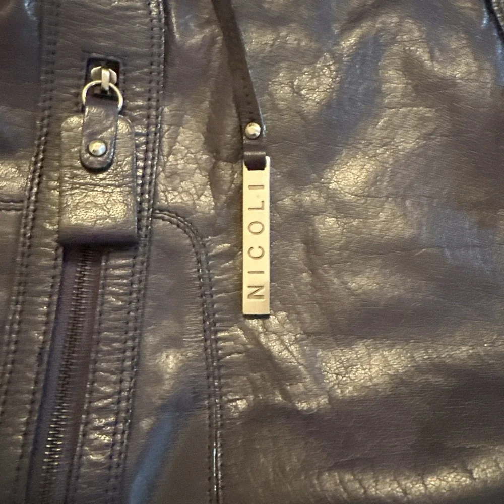 Nicoli Italian leather Large satchel features a dark purplish Blue finish